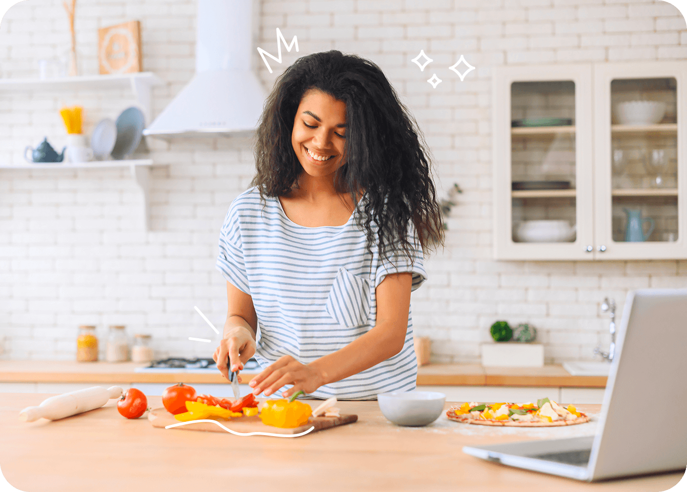 Photo of a happy young woman chopping vegetables for a healthy, balanced meal