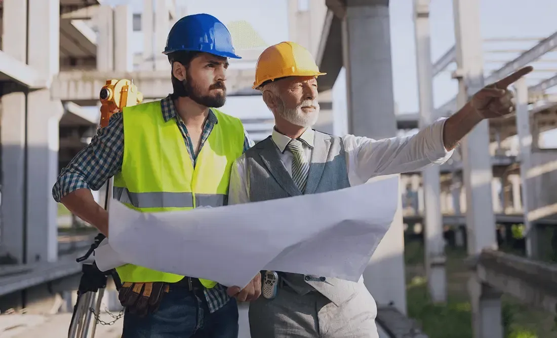 Contractors holding construction plan