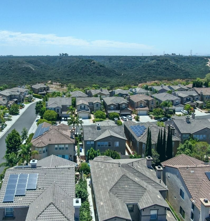 Ariel view of homes with rooftop solar panels