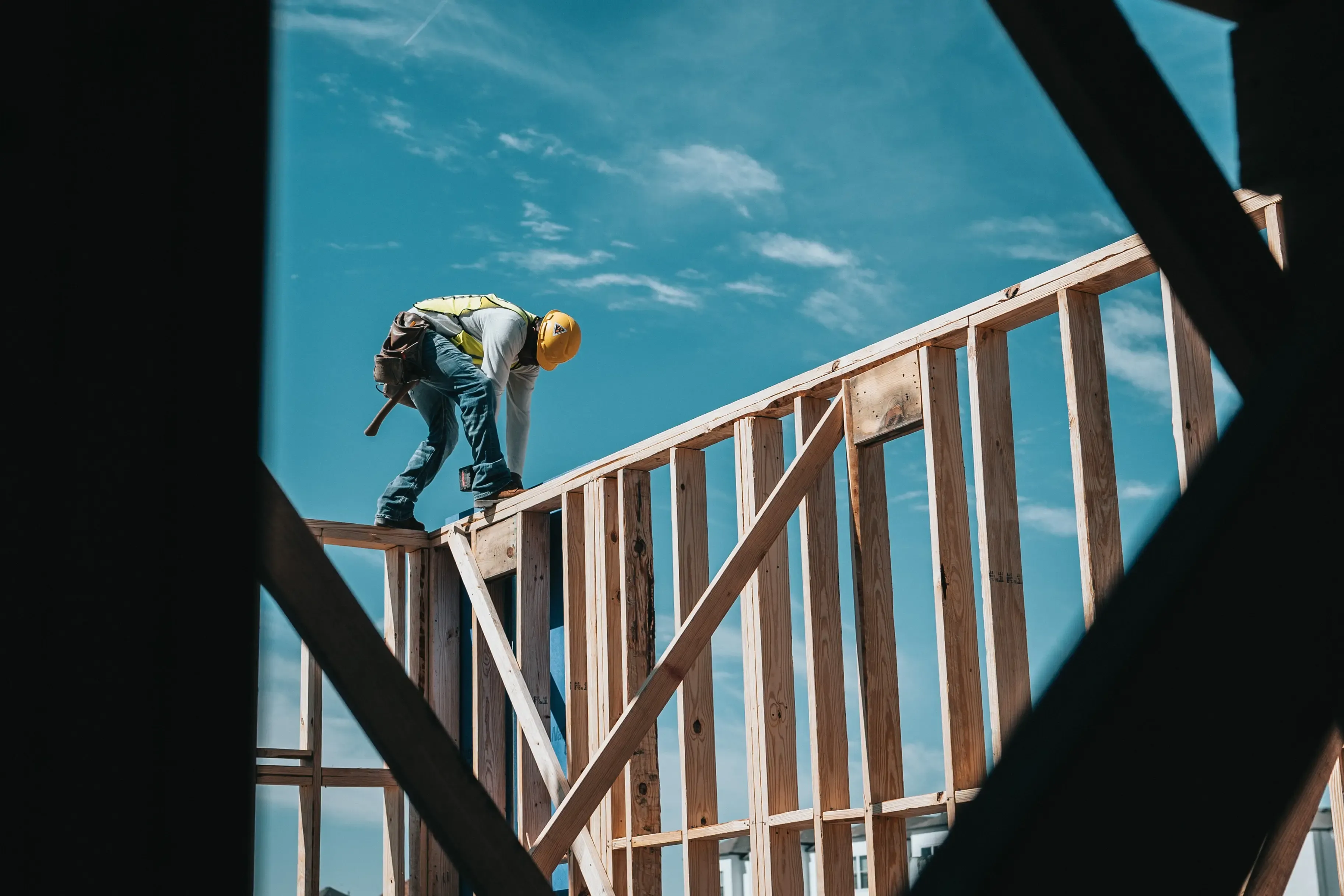 Construction worker on house frame