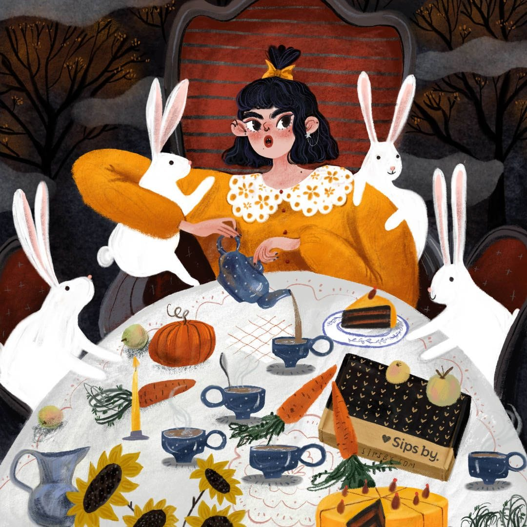 Illustration of an autumn tea party with bunnies, blue teapot and tea cups, sunflowers, cake, a pumpkin, and carrots
