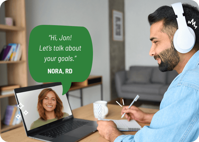 Photo of a satisfied-looking man consulting with a dietitian over video chat