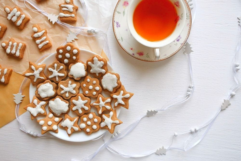 Christmas Cookies & Tea Pairings image with gingerbread cookies and garland - Celebrate the magic of the season with quality time, cookies, and tea. Read more.