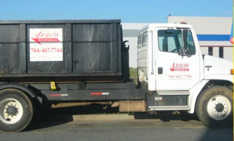 Arrow Disposal truck delivering a dumpster rental