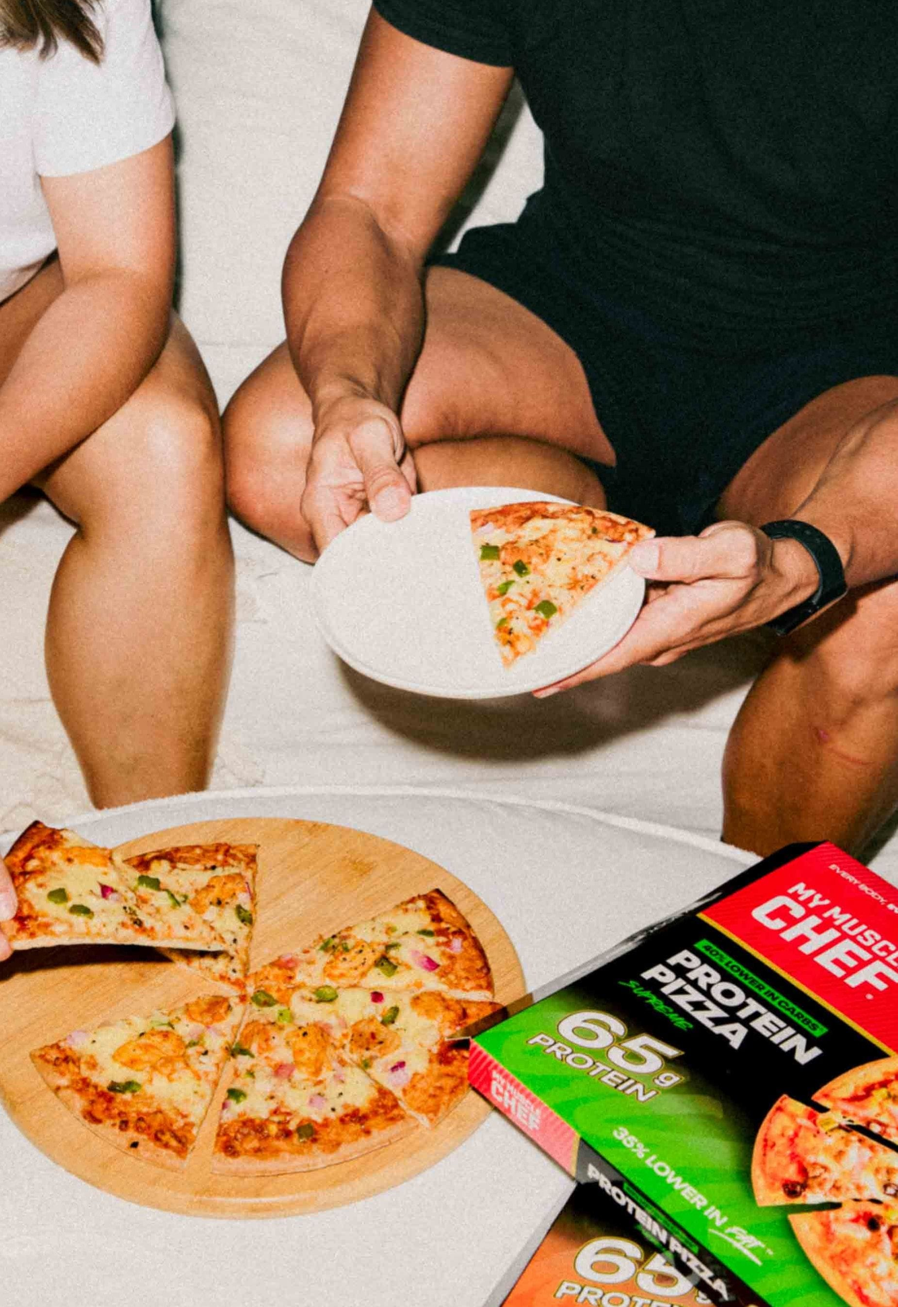 Girl and Boy eating a My Muscle Chef Protein Pizza