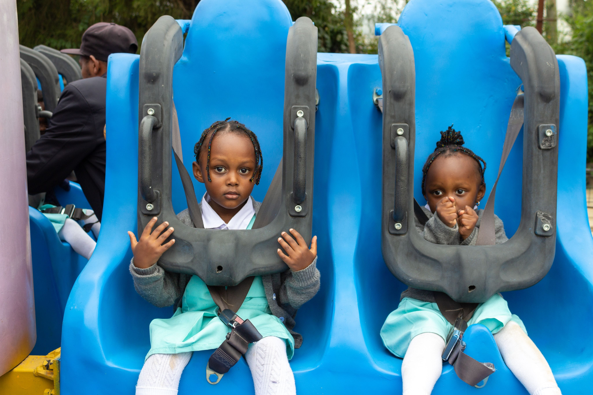 children riding in amusement park