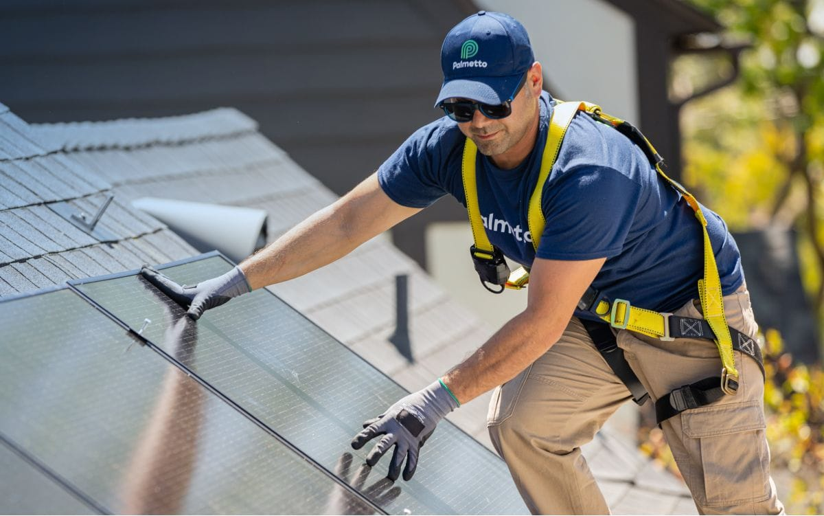 Solar installer placing panels.