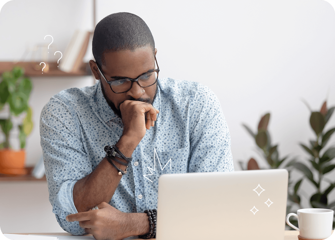 Photo of a thoughtful man reading information from a computer