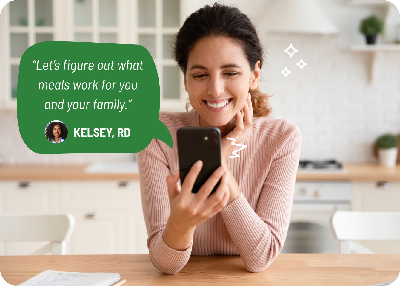 Photo of a woman smiling while consulting her dietitian on a video call