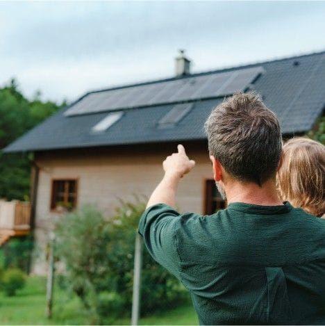 Image of a solar panel being installed on a residential roof.