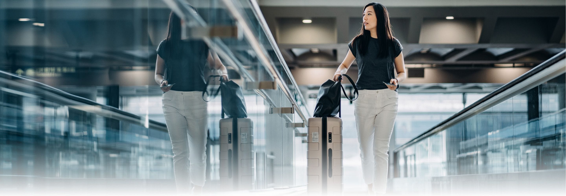 Air Canada airplane in flight over mountains at sunset.