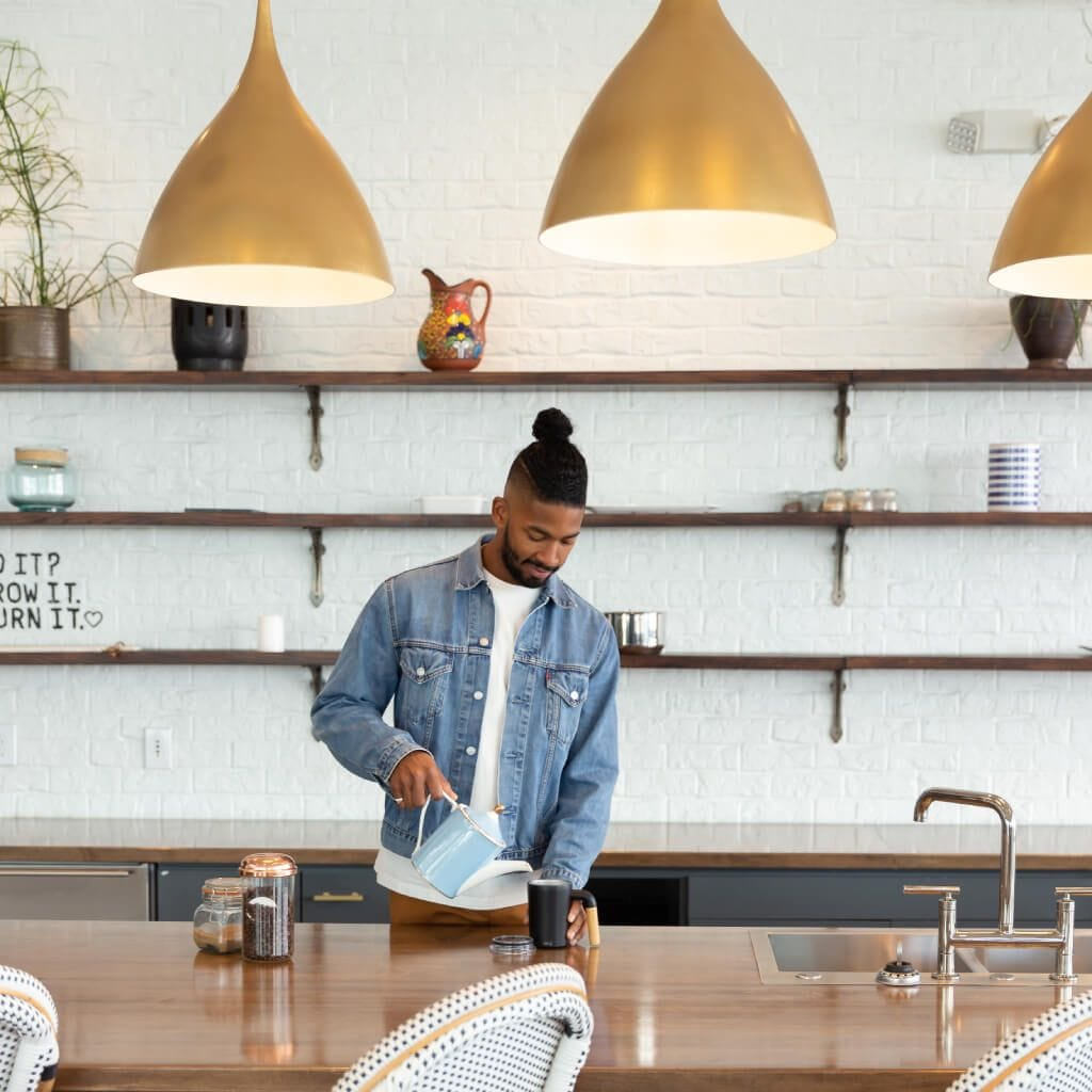 kitchen with man filling waterbottle