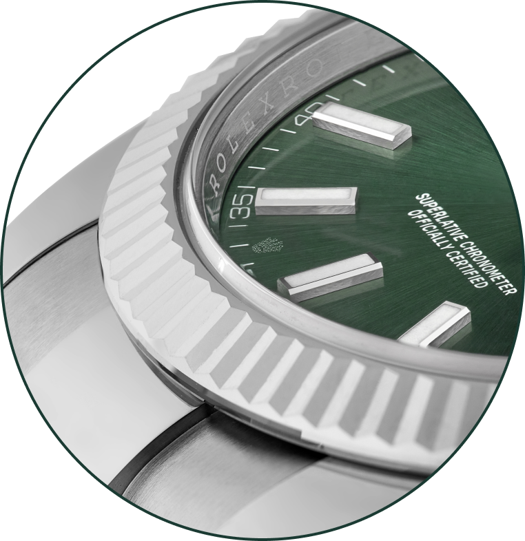 a close-up shot of a silver watch bezel