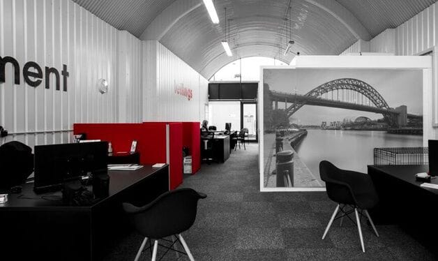 black and white bridge mural in an estate agents office