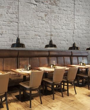 white brick wall mural in a restaurant