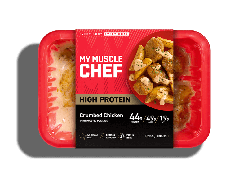 My Muscle Chef High Protein Crumbed Chicken meal with roasted vegetables and lemon herb sauce, featuring 40g protein, Australian made, dietitian approved.