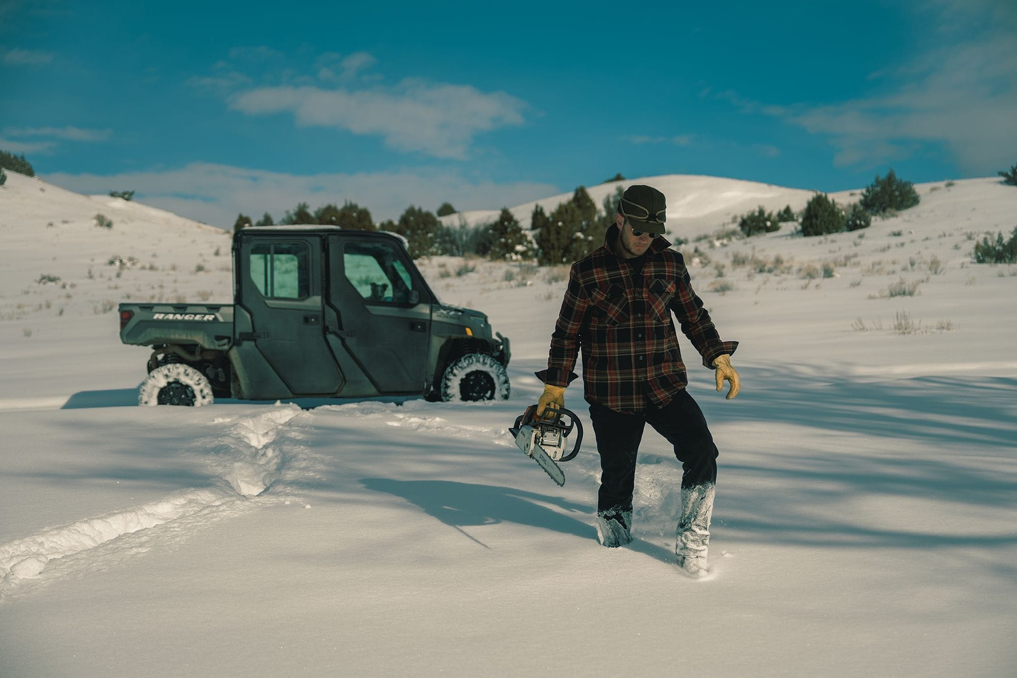 man walking in show in a devium flannel