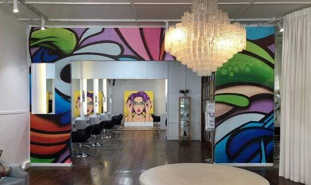 colourful pop art and graffiti wall murals in a salon