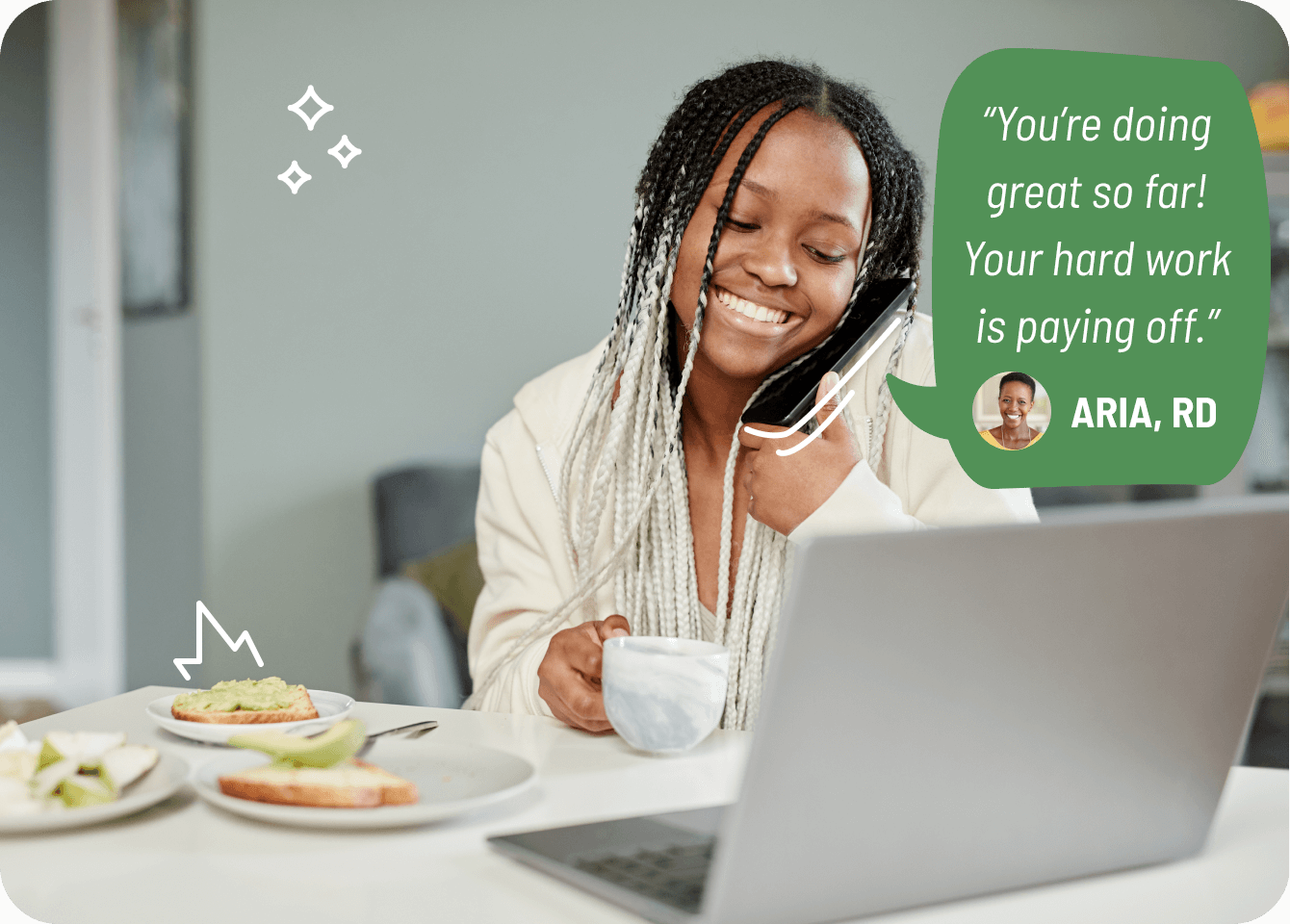 Photo of a happy young woman talking to a registered dietitian over the phone