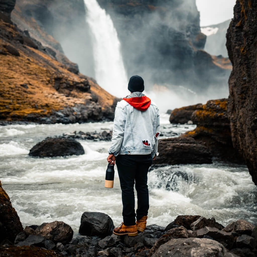 waterbottle at waterfall