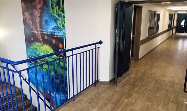 educational wall mural in a college staircase