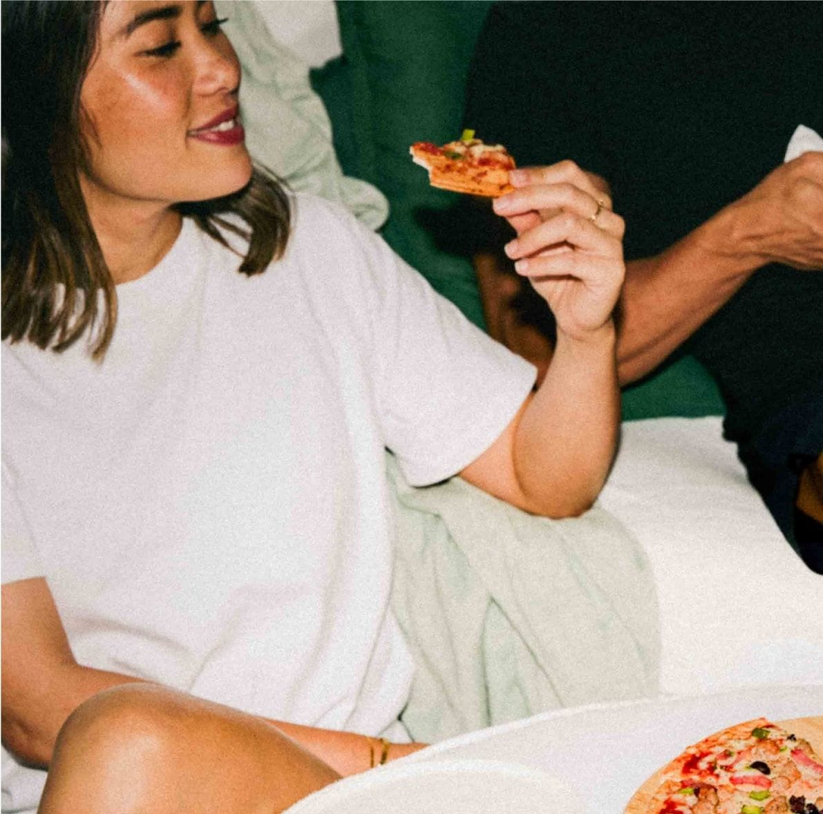 Girl eating a My Muscle Chef Protein Pizza