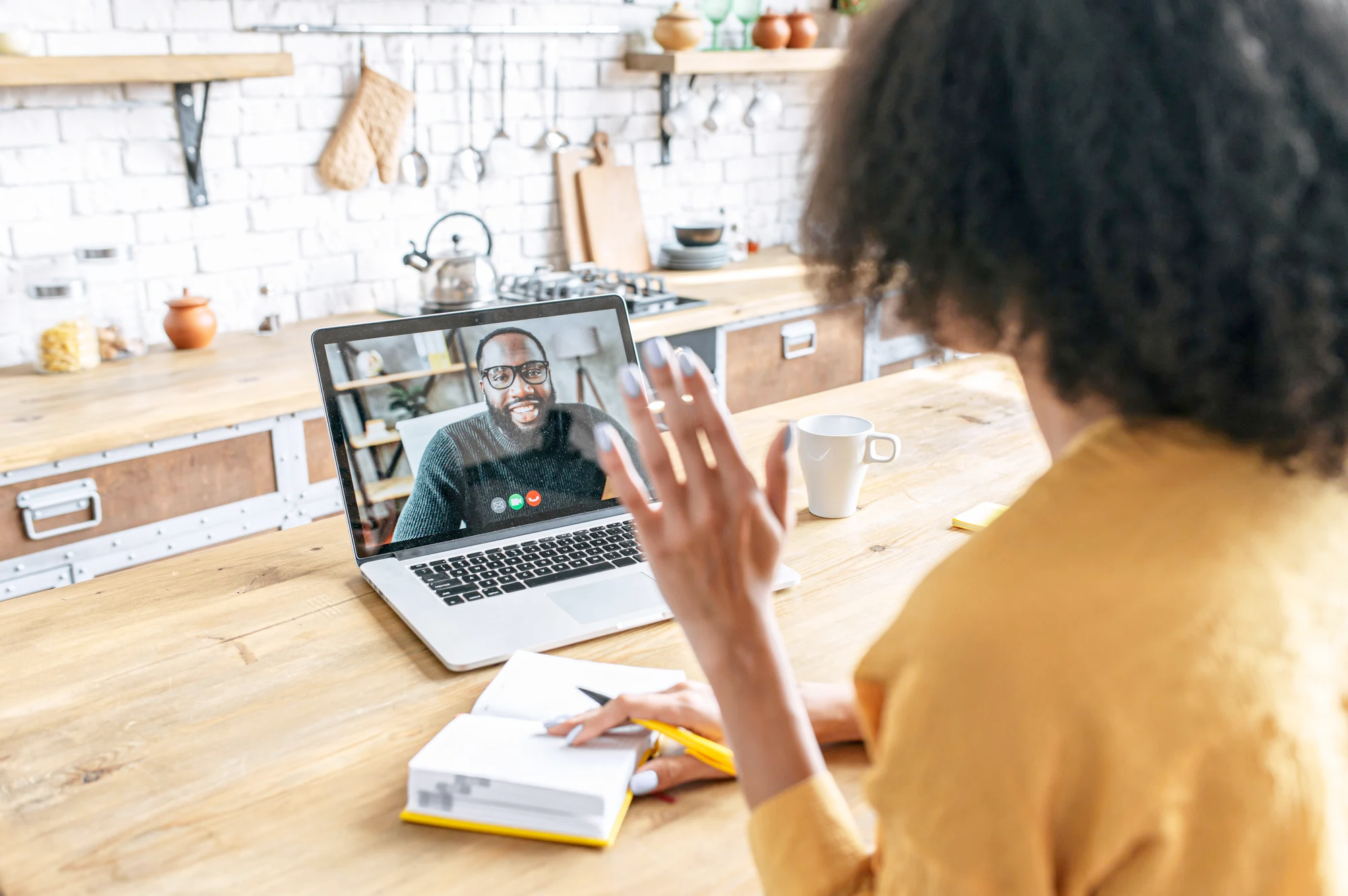 Photo of a happy woman consulting a dietitian about her goals via video chat