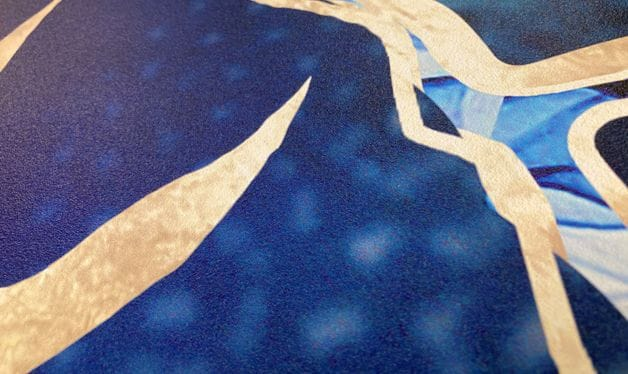close up image of blue and gold IMO wallpaper