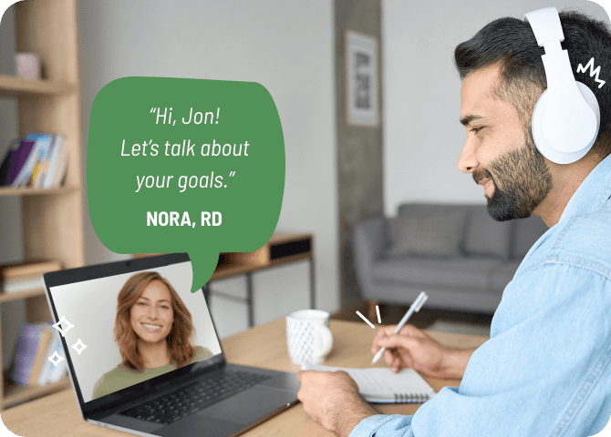 Photo of a satisfied-looking man consulting with a dietitian over video chat