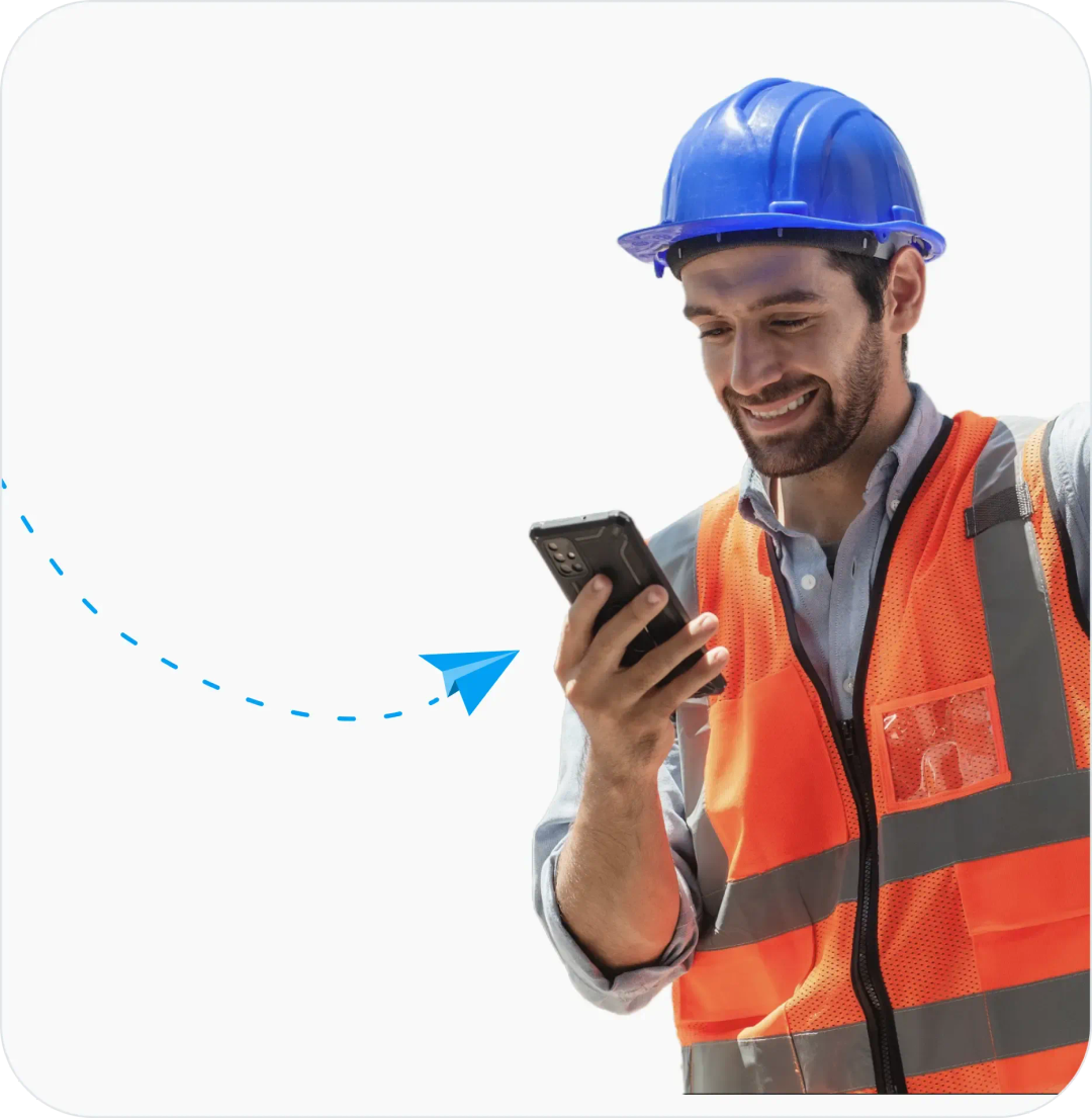 Happy construction subcontractor holding his phone