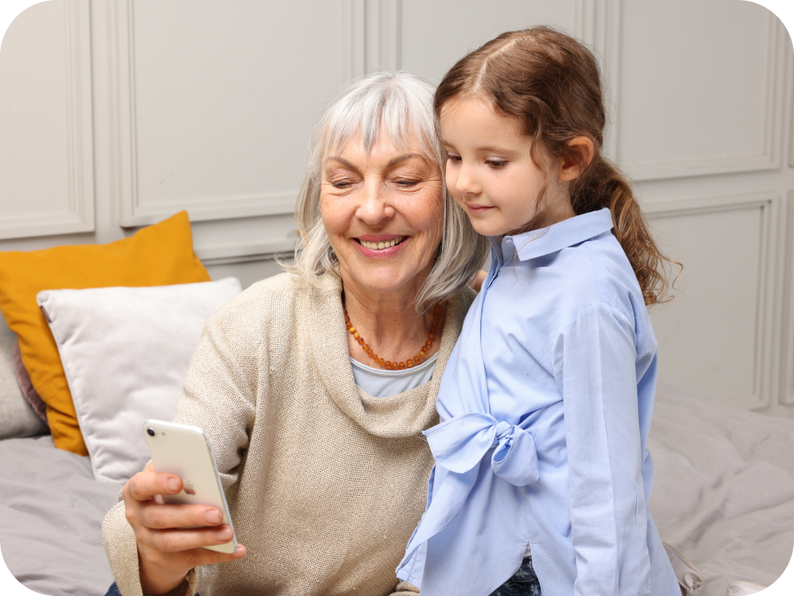Woman showing her grandchild how Cardi Health app works