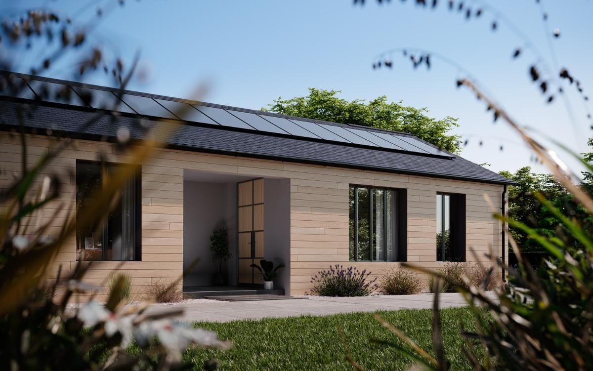 A modern home during the daylight with rooftop solar panels