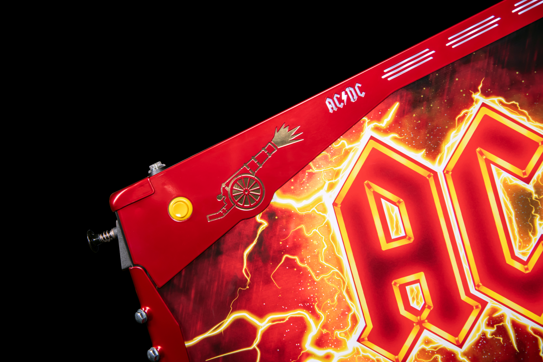 Red powder coated side armor with custom cut decals on the AC/DC Remastered pinball machine by Stern Pinball.