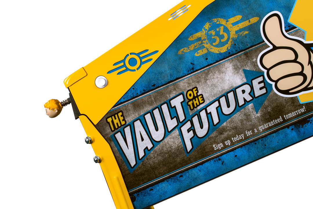 The side cabinet art featuring text reading: 'The Vault of the Future' and laser-cut pinball armor on the Limited Edition Model of Fallout from Stern Pinball.