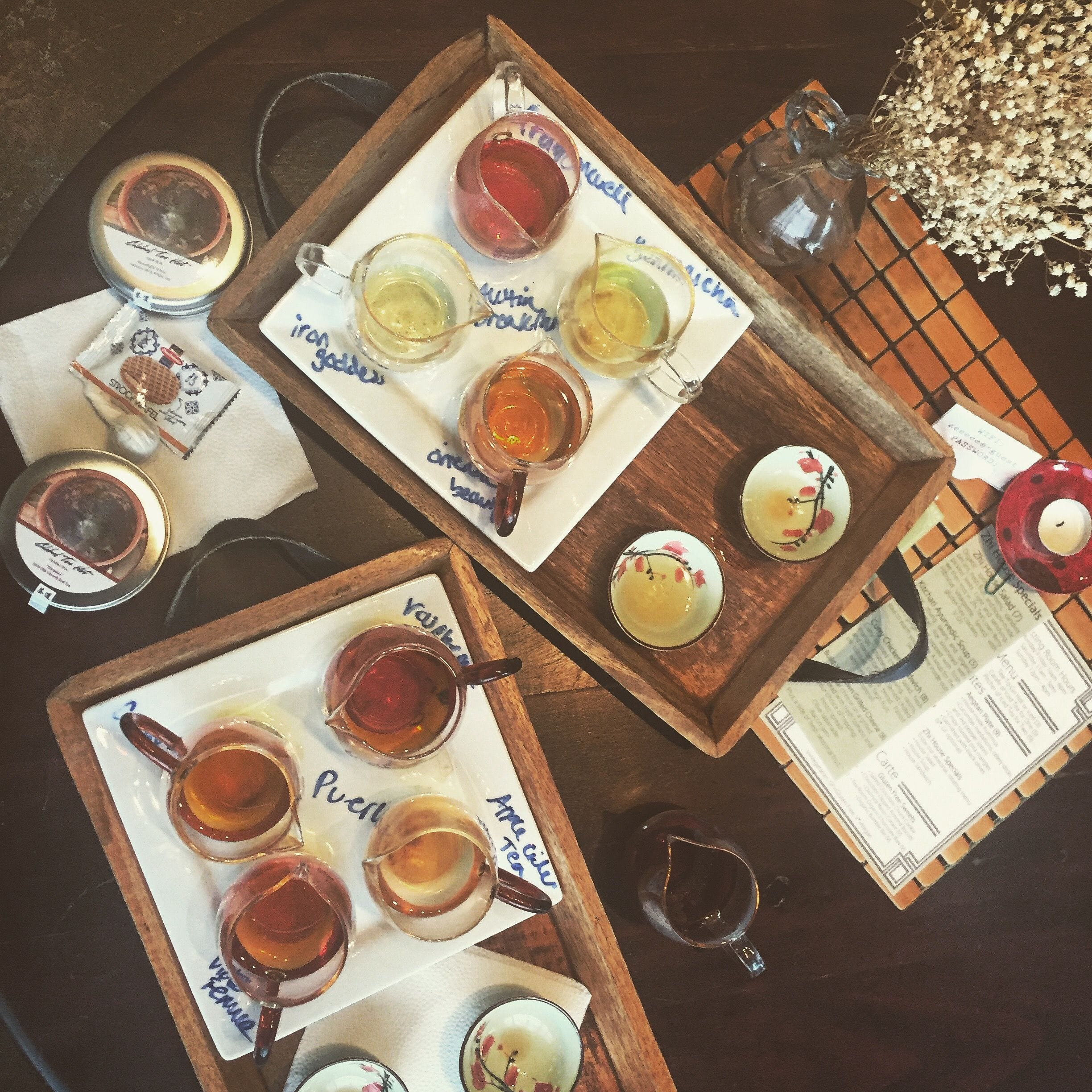 Tea tasting trays with several types of brewed tea